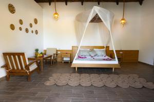 a bedroom with a bed with a mosquito net at Turkuaz Beach Zanzibar in Kumba Urembo +50 photos