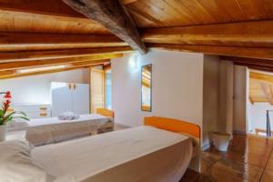 Postel nebo postele na pokoji v ubytování Casa Cao Appartamento Il Ginepro