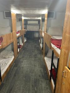 a room with several bunk beds in a van at Sai Sharan Dormitory-Near Dadar Railway Station in Mumbai