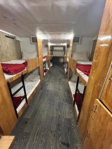 a room with several bunk beds in a van at Sai Sharan Dormitory-Near Dadar Railway Station in Mumbai