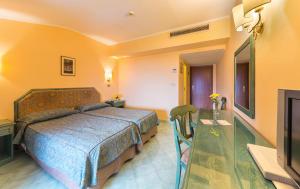 Posteľ alebo postele v izbe v ubytovaní Hotel Iaccarino