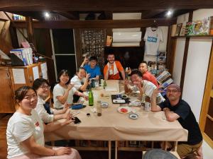a group of people sitting around a table at Tototo Morioka in Morioka
