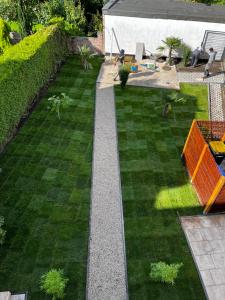 an aerial view of a garden with grass at Lisboa: Messe/Business/FeWo DUS in Hilden