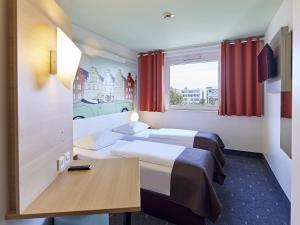 Postel nebo postele na pokoji v ubytování B&B Hotel Osnabrück + 22 fotografií