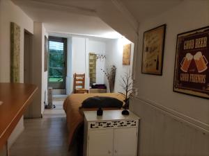a bedroom with a bed and a table in it at Appartements Cote pont Vieux-Self Check-In in Carcassonne