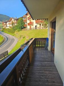 a balcony with a view of a road at Top location ski-to-door two-bedroom apartment in Bach
