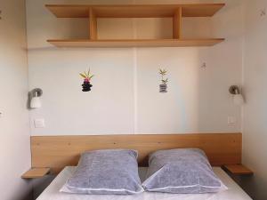 Postel nebo postele na pokoji v ubytování Mobil-home une chambre