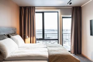 Postel nebo postele na pokoji v ubytování Basecamp Narvik