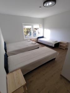 Postel nebo postele na pokoji v ubytování Radikiai House