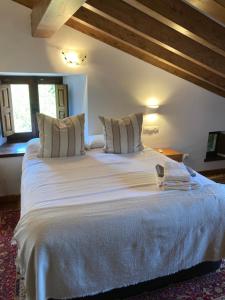 Ένα ή περισσότερα κρεβάτια σε δωμάτιο στο La Valuisilla, hotel rural