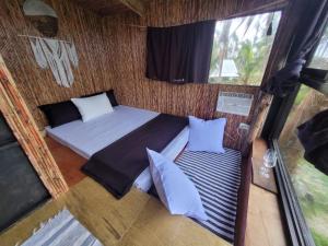 an overhead view of a room with two beds at Tarzan's House in General Luna