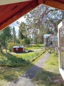 a view of a barn from a window of a house at Tiny House in Nattavaara by in Nattavaara