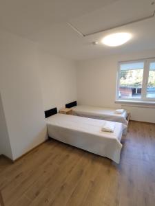 Postel nebo postele na pokoji v ubytování Radikiai House
