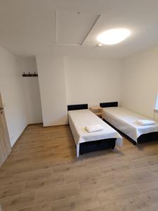 Postel nebo postele na pokoji v ubytování Radikiai House