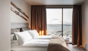 Postel nebo postele na pokoji v ubytování Basecamp Narvik