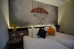 Voodi või voodid majutusasutuse Hotel Sriti Magelang toas