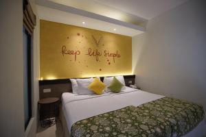 Voodi või voodid majutusasutuse Hotel Sriti Magelang toas