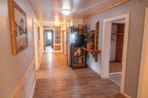a hallway of a home with wooden floors at Hostel - Ron`s Guesthouse in Oberstdorf +32 photos