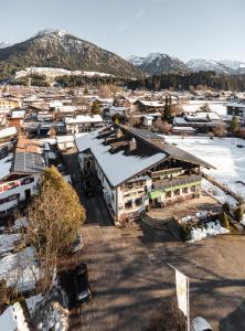 an aerial view of a town with snow covered buildings at Hostel - Ron`s Guesthouse in Oberstdorf