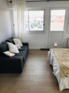 Posezení v ubytování Appartement lumineux 2 chambres + 6 fotografií