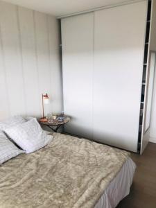 Postel nebo postele na pokoji v ubytování Appartement lumineux 2 chambres