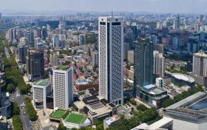 an aerial view of a city with tall buildings at Jinling Hotel in Nanjing