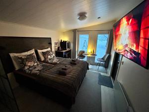 a bedroom with a large bed and a large window at Guest house - Northern tealight in Rovaniemi