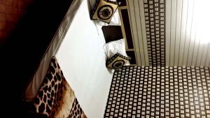 a view of a room with a bed and a table at Punjabi Residency(niwas) in Amritsar