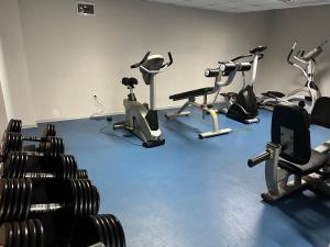 a gym with several exercise bikes in a room at Belvedere Holiday Club nice place in Bansko