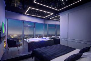 Televízia a/alebo spoločenská miestnosť v ubytovaní In The Sky - Apartamenty w Sky Tower