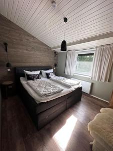 a bedroom with two beds and a window at Ferienhaus Bergwild in Winterberg