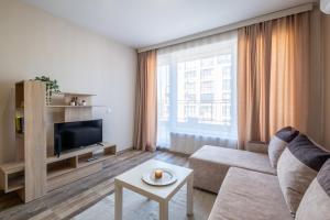 TV a/nebo společenská místnost v ubytování Cozy Homes 1