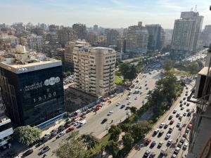 an aerial view of a busy city street with cars at Best view , New furniture Gameat Al Dewal Al Arbeya in Cairo