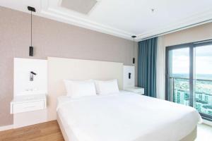 Postel nebo postele na pokoji v ubytování Radisson Residences Avrupa TEM Istanbul