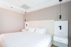 Postel nebo postele na pokoji v ubytování Radisson Residences Avrupa TEM Istanbul