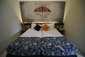 Voodi või voodid majutusasutuse Hotel Sriti Magelang toas