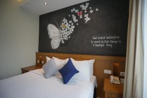 Voodi või voodid majutusasutuse Hotel Sriti Magelang toas