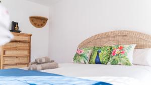 Postel nebo postele na pokoji v ubytování Banana Beach Patacona Rooms