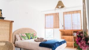 Postel nebo postele na pokoji v ubytování Banana Beach Patacona Rooms