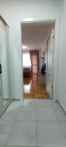 an open hallway with a room with a bed in it at Apartman Ema in Valjevo