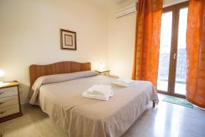 Posteľ alebo postele v izbe v ubytovaní Etna-Royal-View-Appartamento-Trilocale