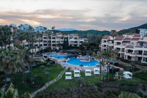 an aerial view of a resort with two pools at Wyndham Grand Costa del Sol in Mijas Costa