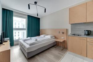 Posteľ alebo postele v izbe v ubytovaní Apartments Old Town Angielska Grobla & by Noclegi Renters