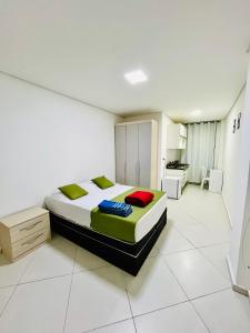 En eller flere senge i et værelse på Flat Gru