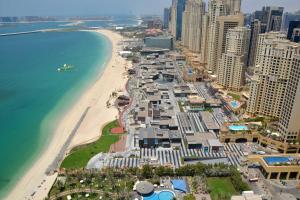 an aerial view of a beach and the ocean at Maison Privee - Premium Apt in the Heart of JBR Beach, Dubai in Dubai