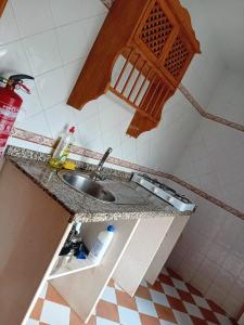 a kitchen counter with a sink in a bathroom at Caserío de Vazquez 5 in Castilblanco de los Arroyos