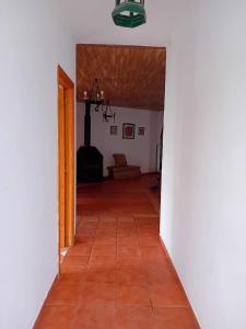 an empty hallway with a room with a floor at Caserío de Vazquez 5 in Castilblanco de los Arroyos