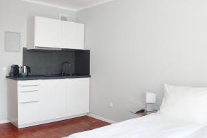 Ένα ή περισσότερα κρεβάτια σε δωμάτιο στο Hometown-Apartments