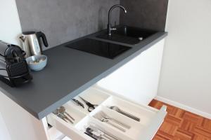 Η κουζίνα ή μικρή κουζίνα στο Hometown-Apartments +14 φωτογραφίες