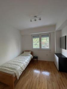 Postel nebo postele na pokoji v ubytování Two bedroom Apartment in Skopje Center